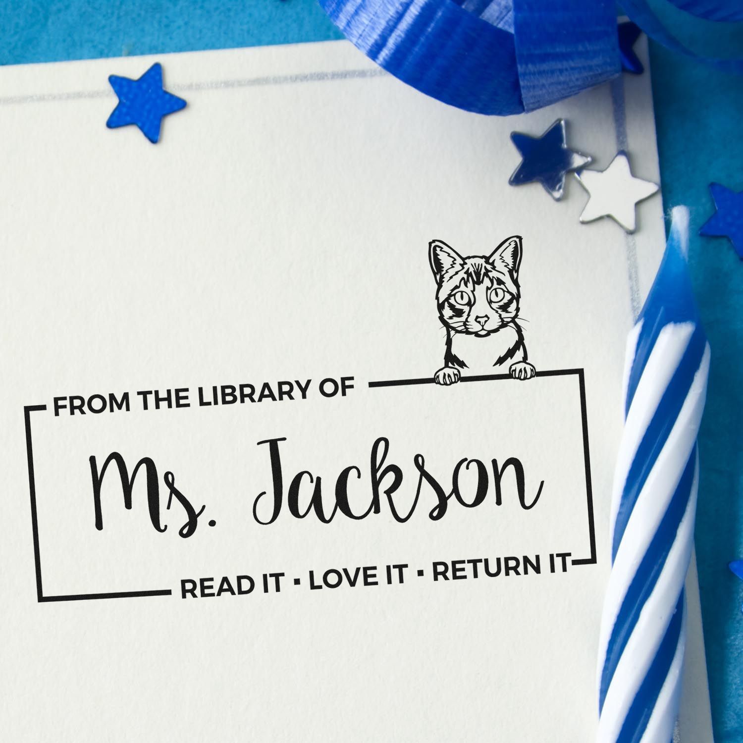 Personalized cat library rubber stamp for Ms. Jackson with Read it, Love It, Return It book plate design.