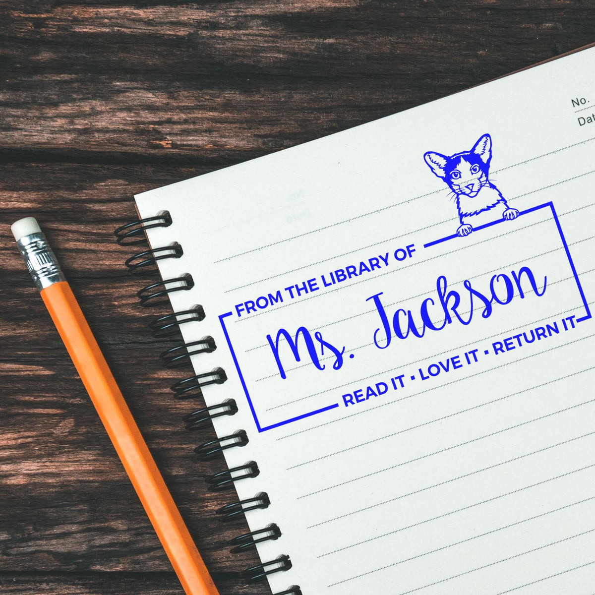 Custom library rubber stamp with cat design and From the Library of Ms. Jackson return-it book ownership imprint.