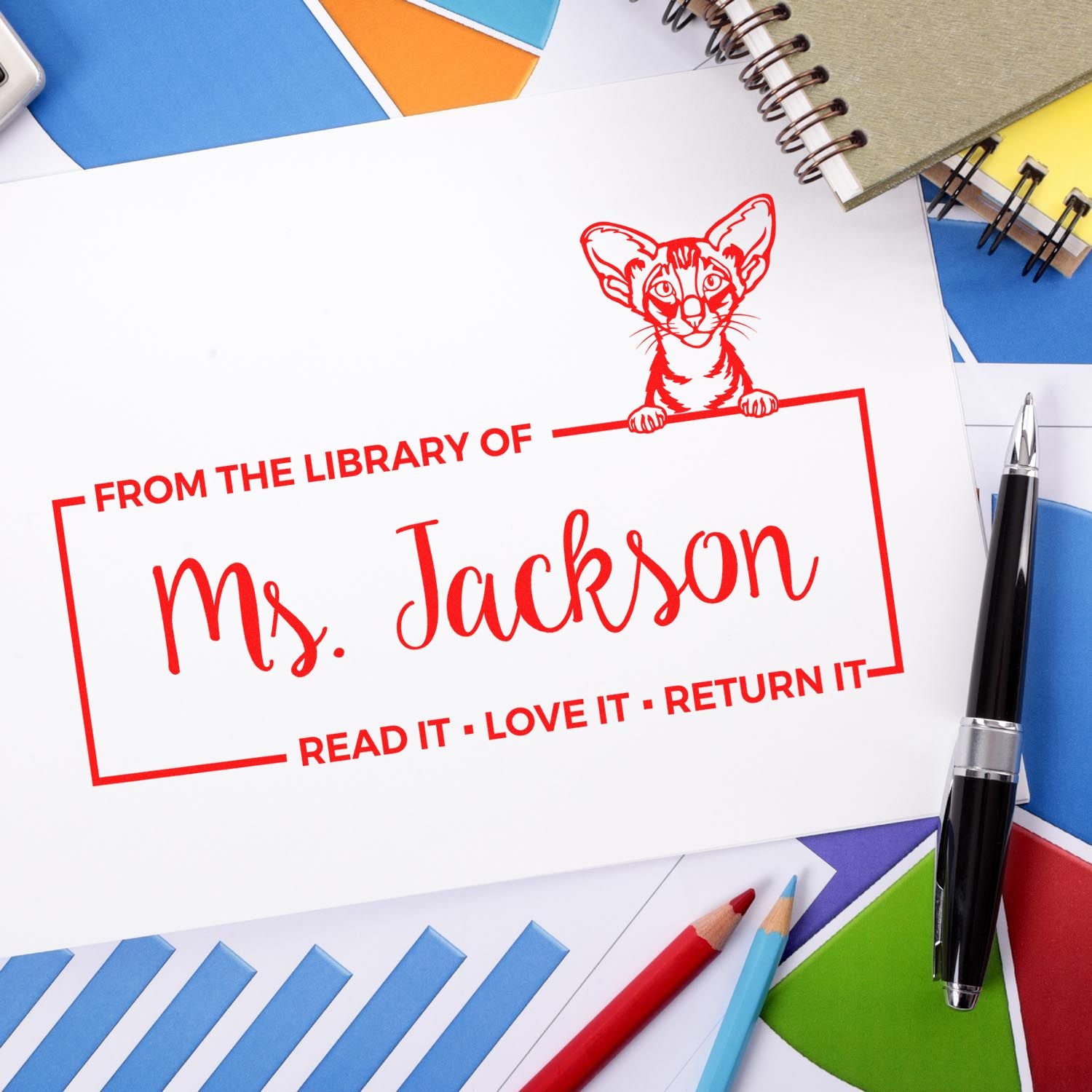 Custom library rubber stamp reading "From the Library of Ms. Jackson" with cat graphic for personalized book return labels.