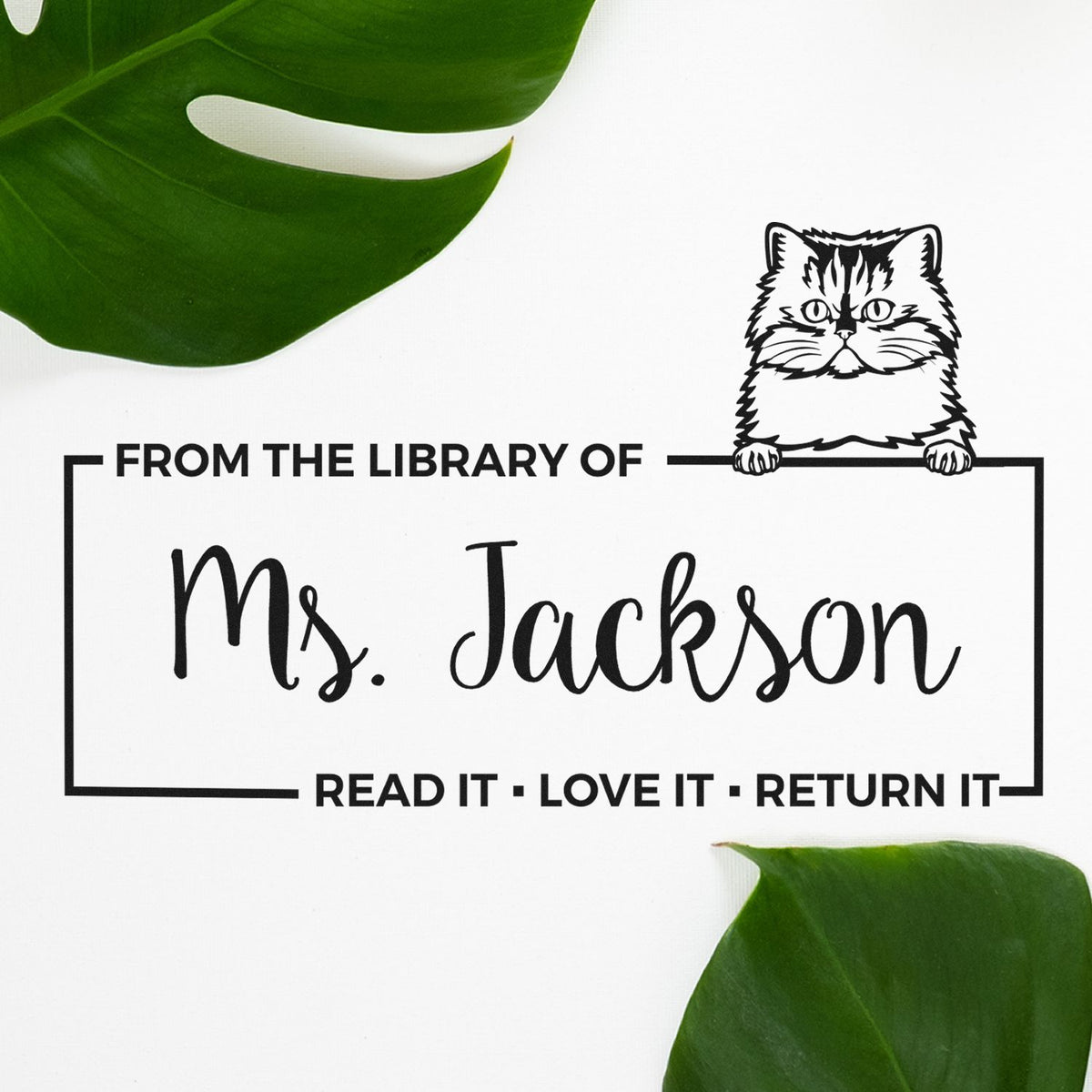 Custom library return rubber stamp for Ms. Jackson, with cat design and Read it, love it, return it book label.