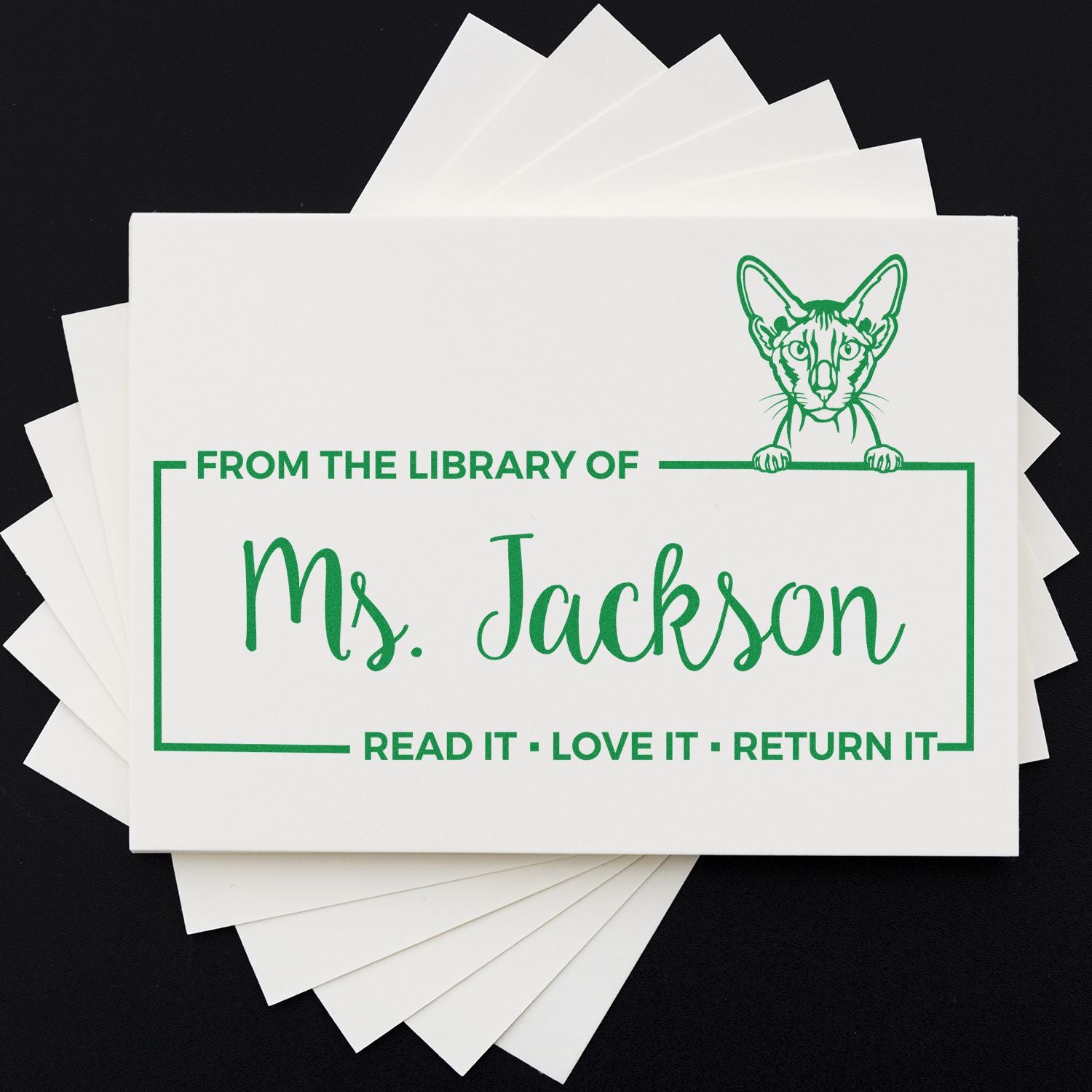 Custom library rubber stamp with cat design, reading From the Library of Ms. JacksonRead it, Love it, Return it.
