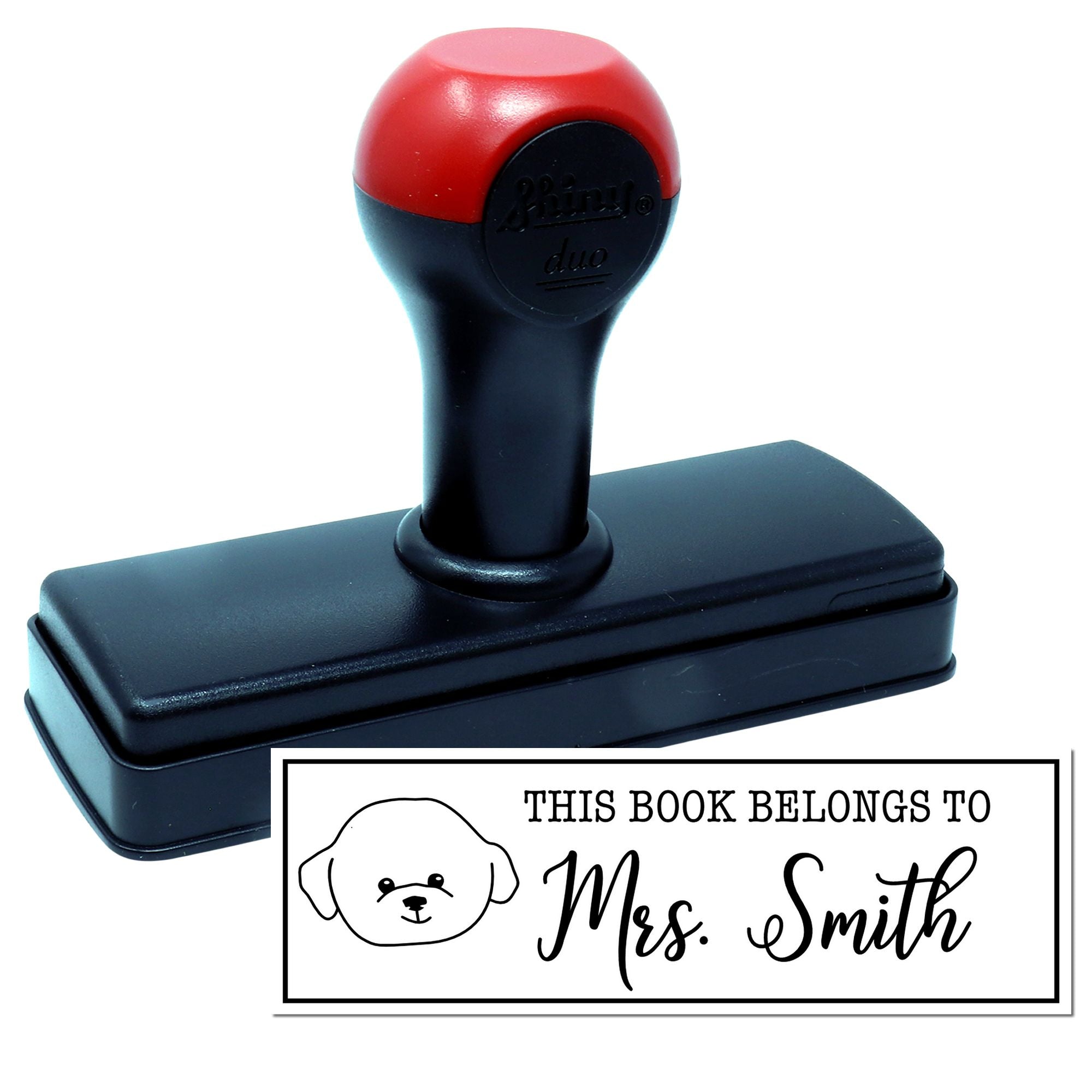 Custom self-inking rubber stamp with This Book Belongs To Mrs. Smith bookplate design for personalized library marking.