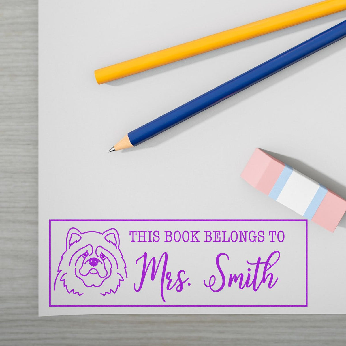 Custom rubber book stamp with dog design and Mrs. Smith name for personalized bookplate and library labeling.