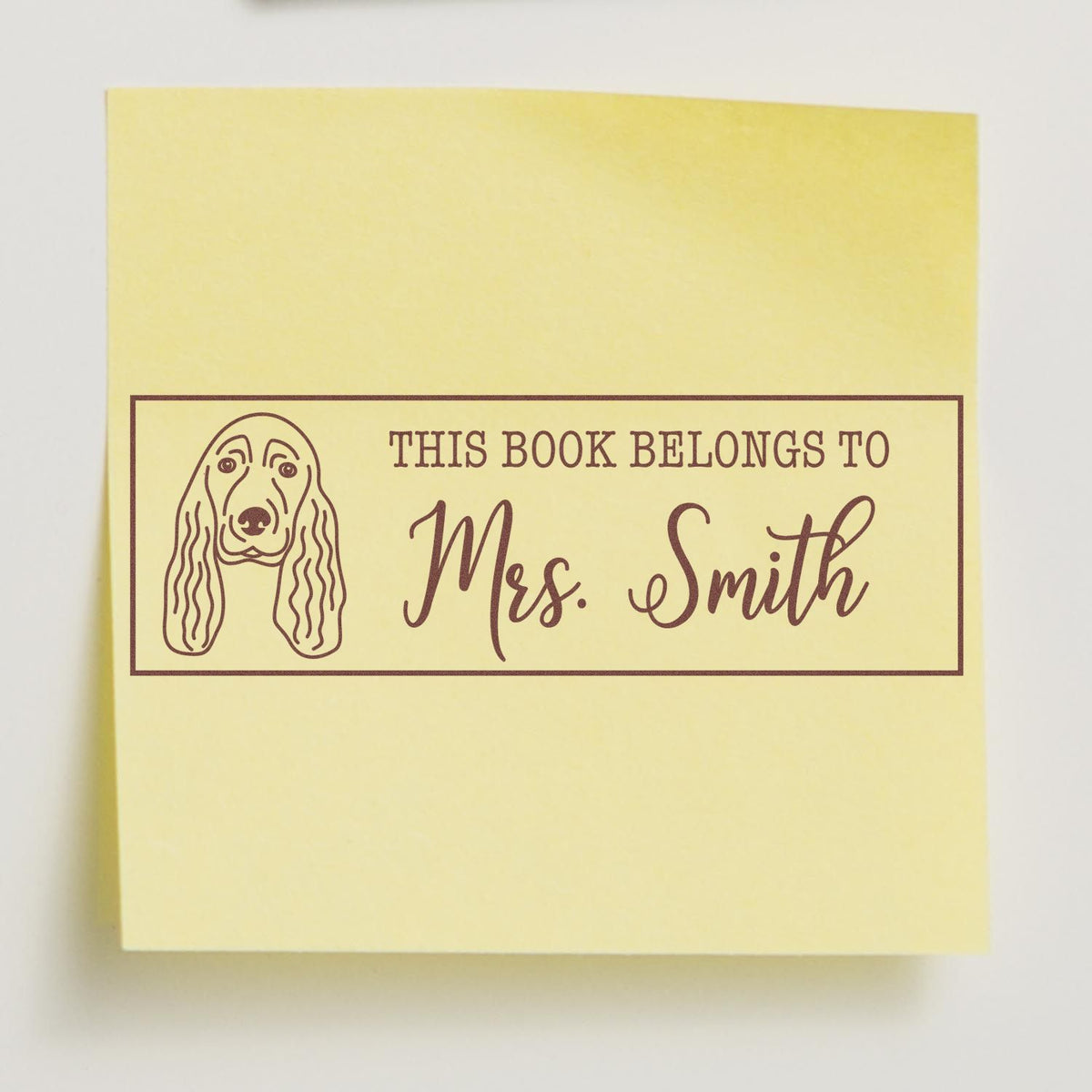 Personalized rubber stamp for books with dog portrait and This Book Belongs To Mrs. Smith custom library label.