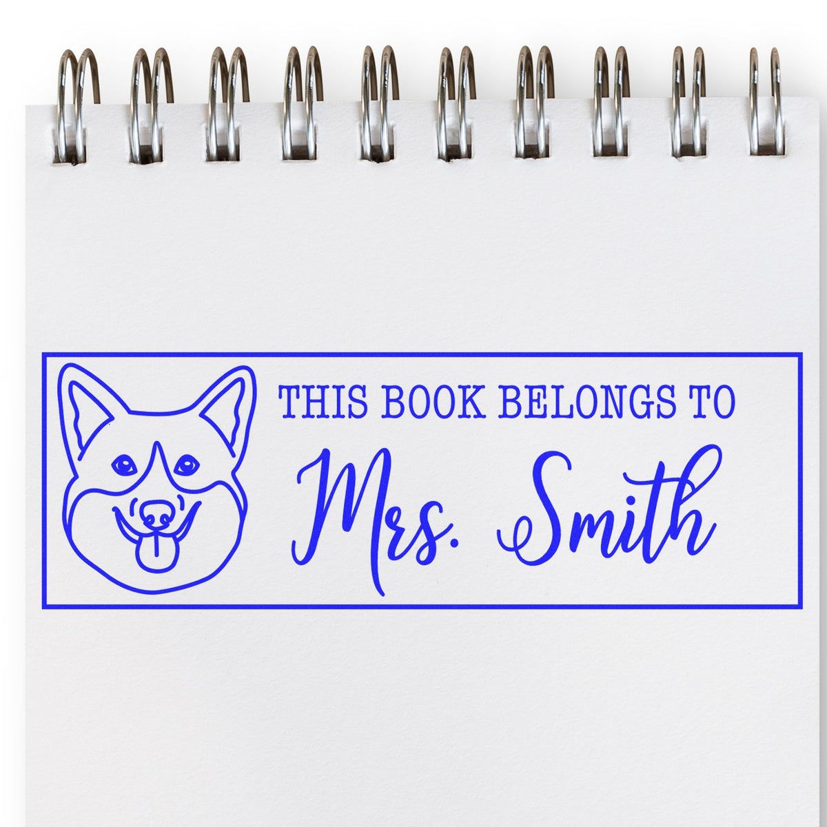 Personalized dog book stamp with This book belongs to Mrs. Smith for custom library ownership marking.