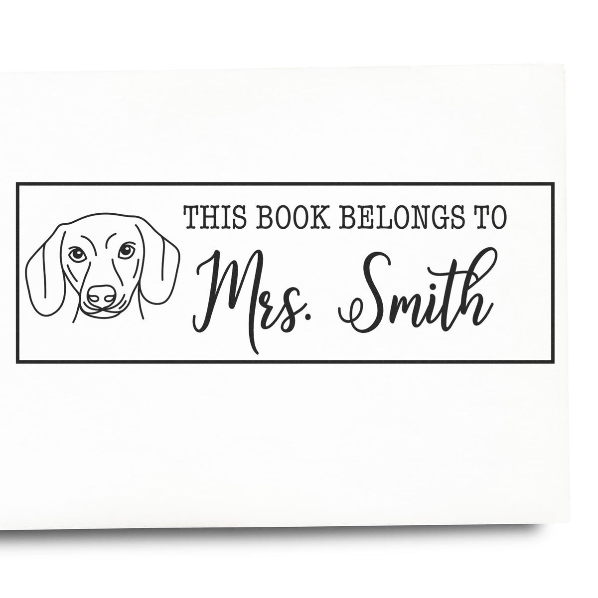 Custom dog book stamp reading This Book Belongs to Mrs. Smith for personal library labeling and book ownership.