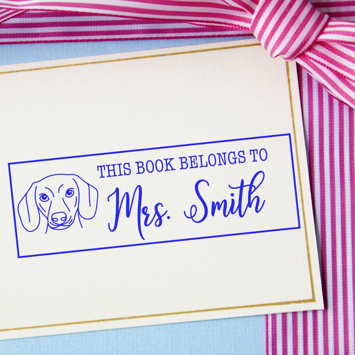Personalized dog rubber stamp reading This Book Belongs to Mrs. Smith for books, gifts, and library labels