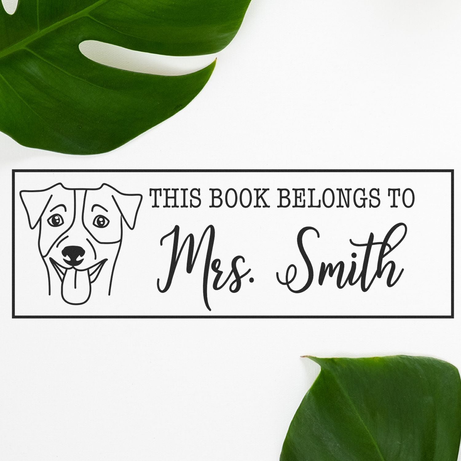 Personalized dog book stamp reading This Book Belongs to Mrs. Smith for custom library and teacher book labeling.