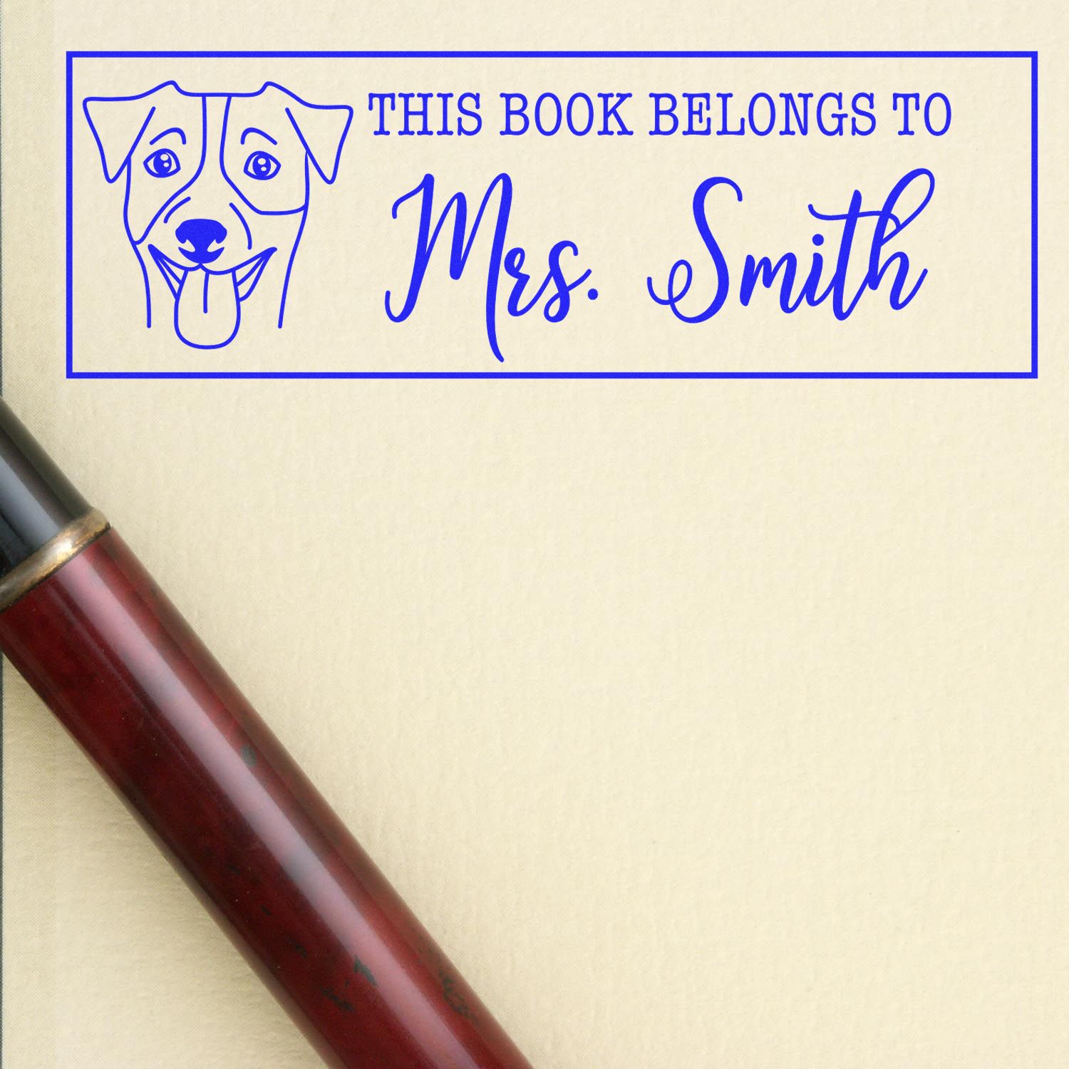 Personalized dog bookplate rubber stamp reading This Book Belongs to Mrs. Smith for custom library books.