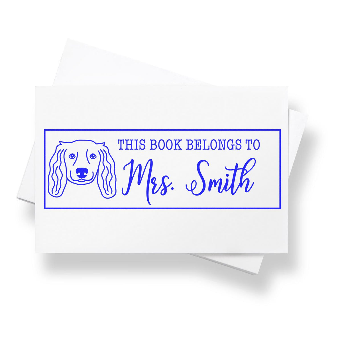 Personalized rubber stamp design with dog illustration and This Book Belongs to Mrs. Smith bookplate.