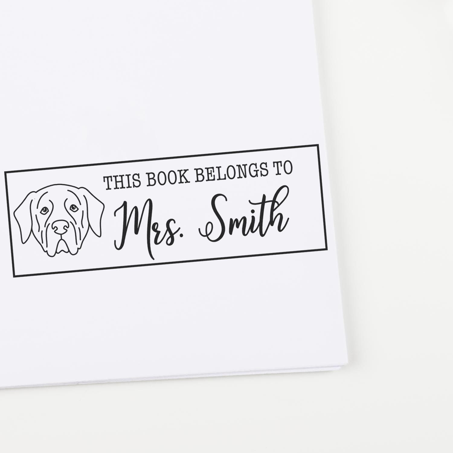 Personalized dog rubber stamp reading This Book Belongs to Mrs. Smith for custom library books and gifts.