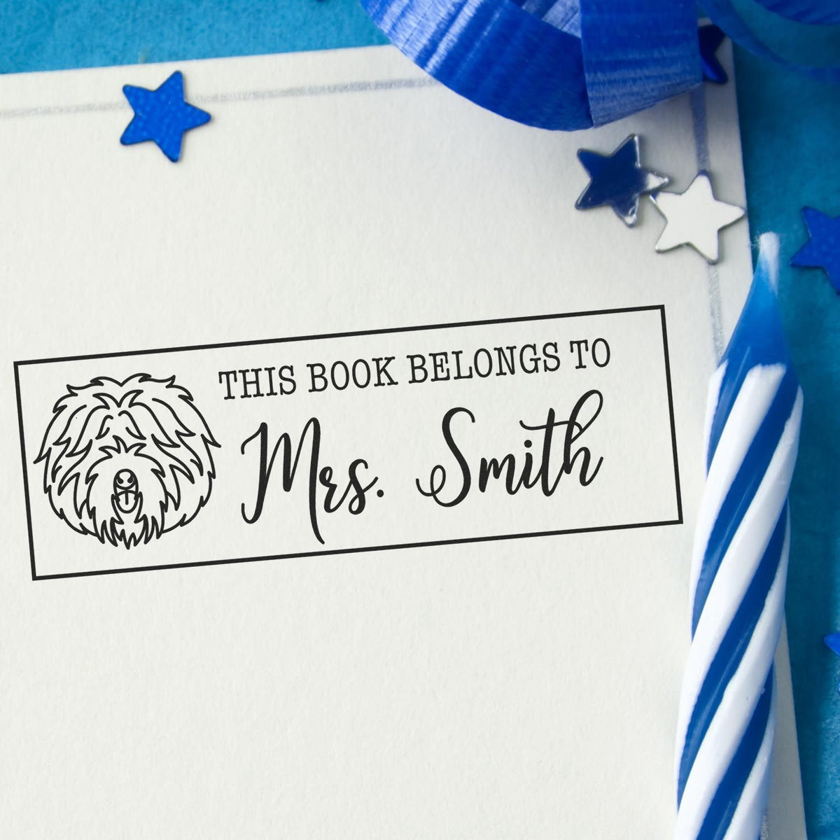 Custom rubber stamp bookplate reading This Book Belongs to Mrs. Smith with dog illustration for classroom library books.