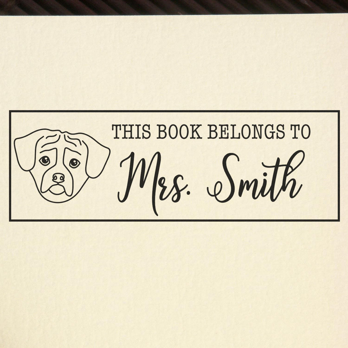 Personalized dog book stamp with This Book Belongs to Mrs. Smith for custom library labeling.