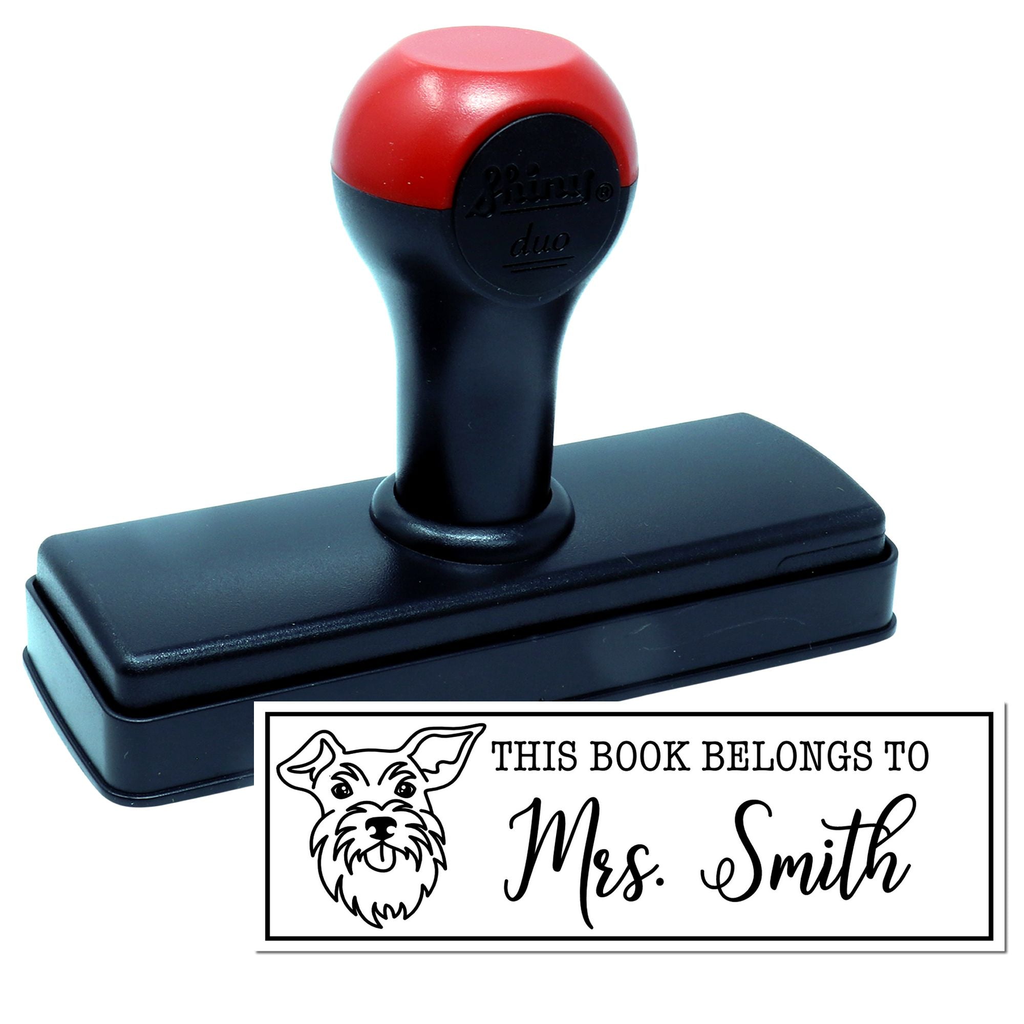 Personalized self-inking rubber book stamp with dog design and This Book Belongs to Mrs. Smith ownership mark.