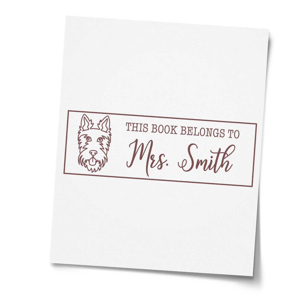 Custom book stamp with dog design reading This Book Belongs to Mrs. Smith for personal library use.