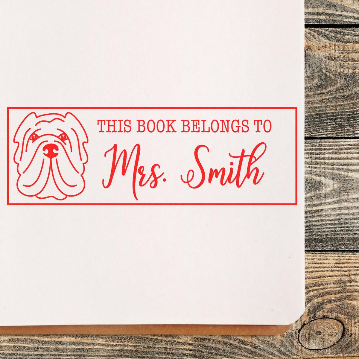 Personalized custom book stamp with dog design and This Book Belongs to Mrs. Smith for home or classroom use.