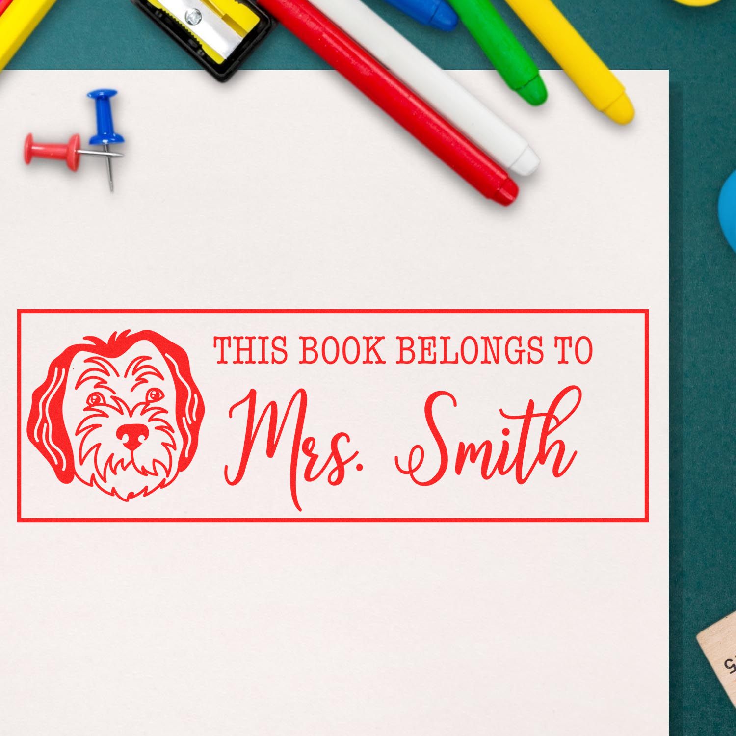 Personalized rubber stamp bookplate for Mrs. Smith with dog design, marking books with a custom This book belongs to message.