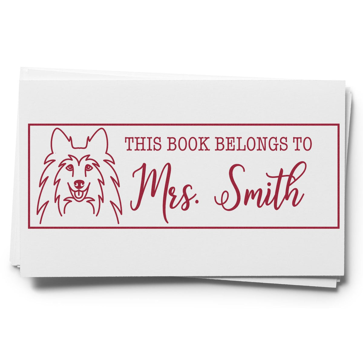 Personalized custom rubber stamp with dog illustration and This Book Belongs to Mrs. Smith bookplate design.