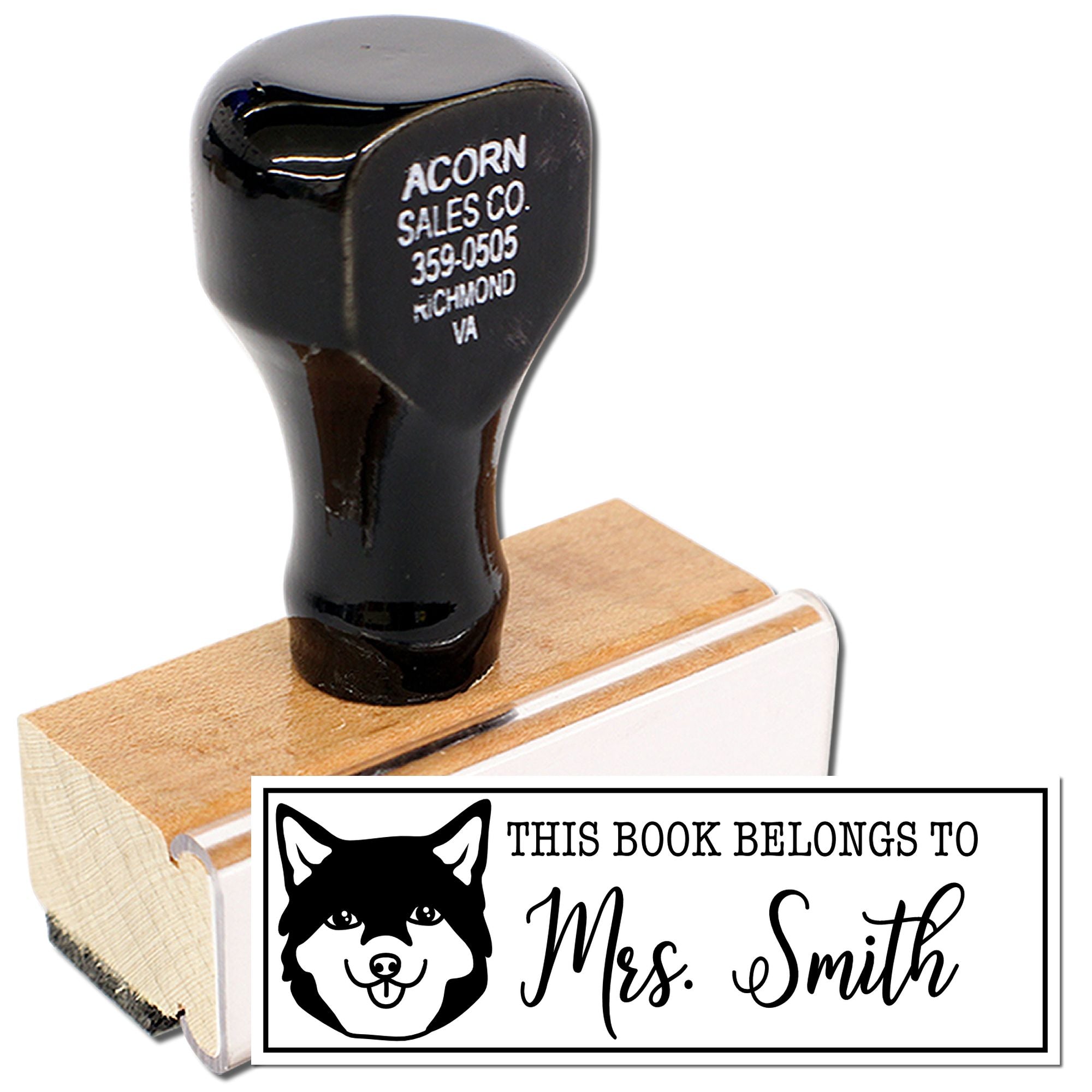 Personalized rubber book stamp with dog design and This Book Belongs To Mrs. Smith text for custom library marking.