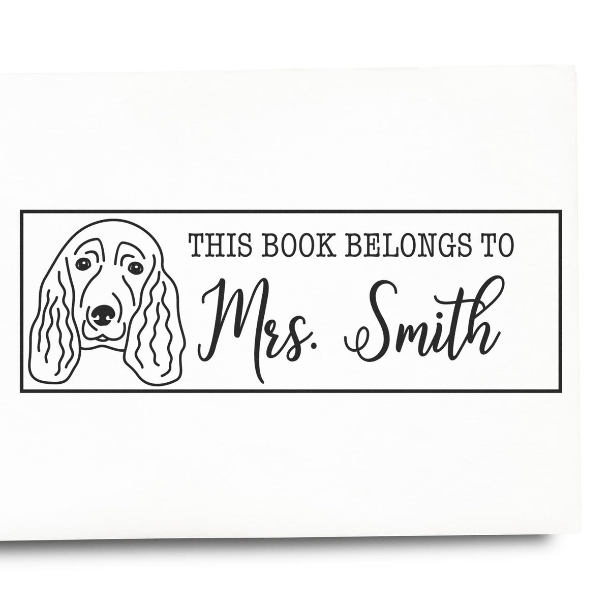Custom rubber stamp with dog illustration and This Book Belongs to Mrs. Smith for personalized book labeling