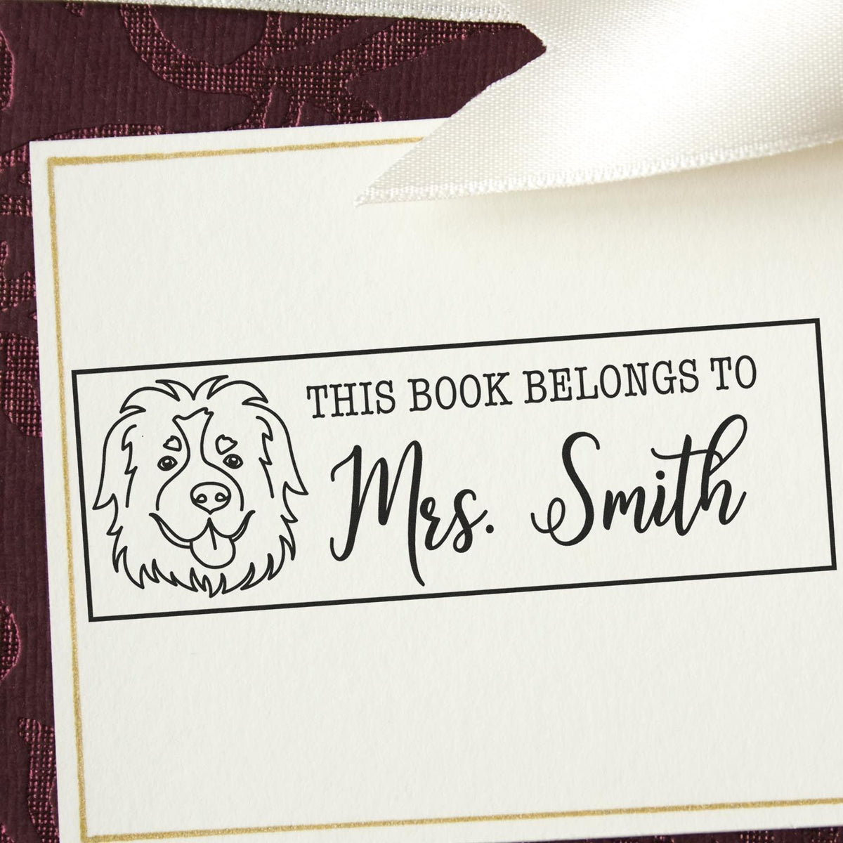 Personalized bookplate rubber stamp with dog illustration and custom name, perfect for marking childrens books.