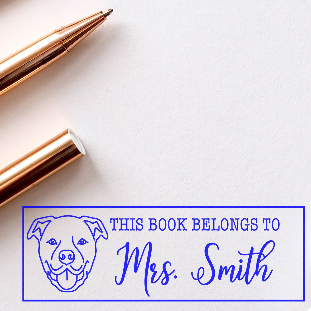 Custom rubber book stamp with dog design and Mrs. Smith name, ideal for personalized library marking.