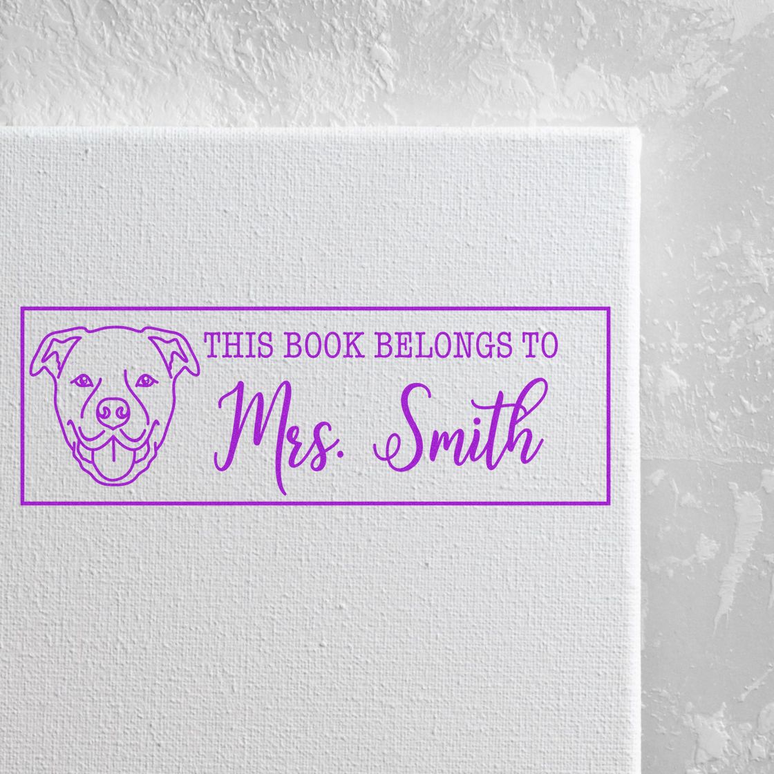 Custom dog bookplate rubber stamp reading This Book Belongs to Mrs. Smith for personalized library books.