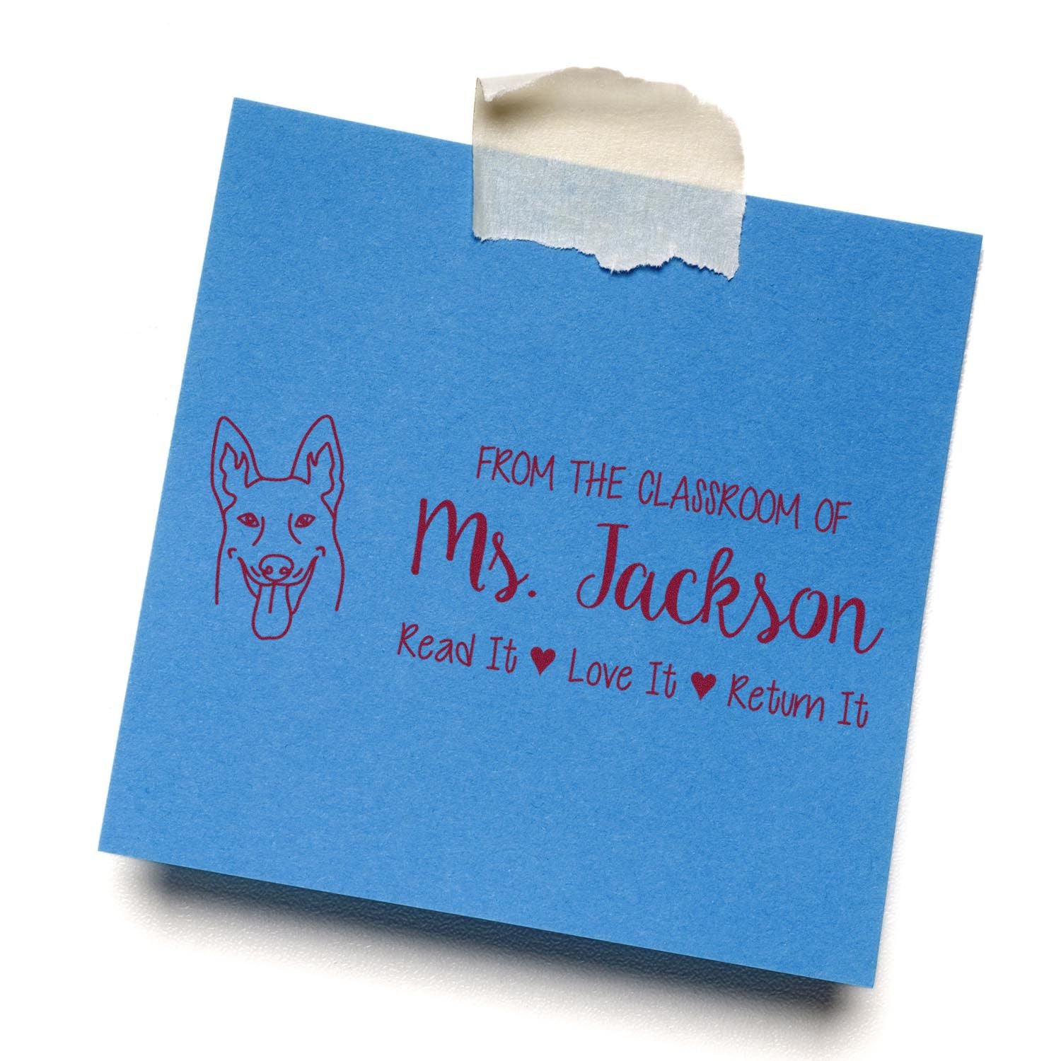Custom teacher rubber stamp on blue cardstock: From the classroom of Ms. JacksonRead it, Love it, Return it.