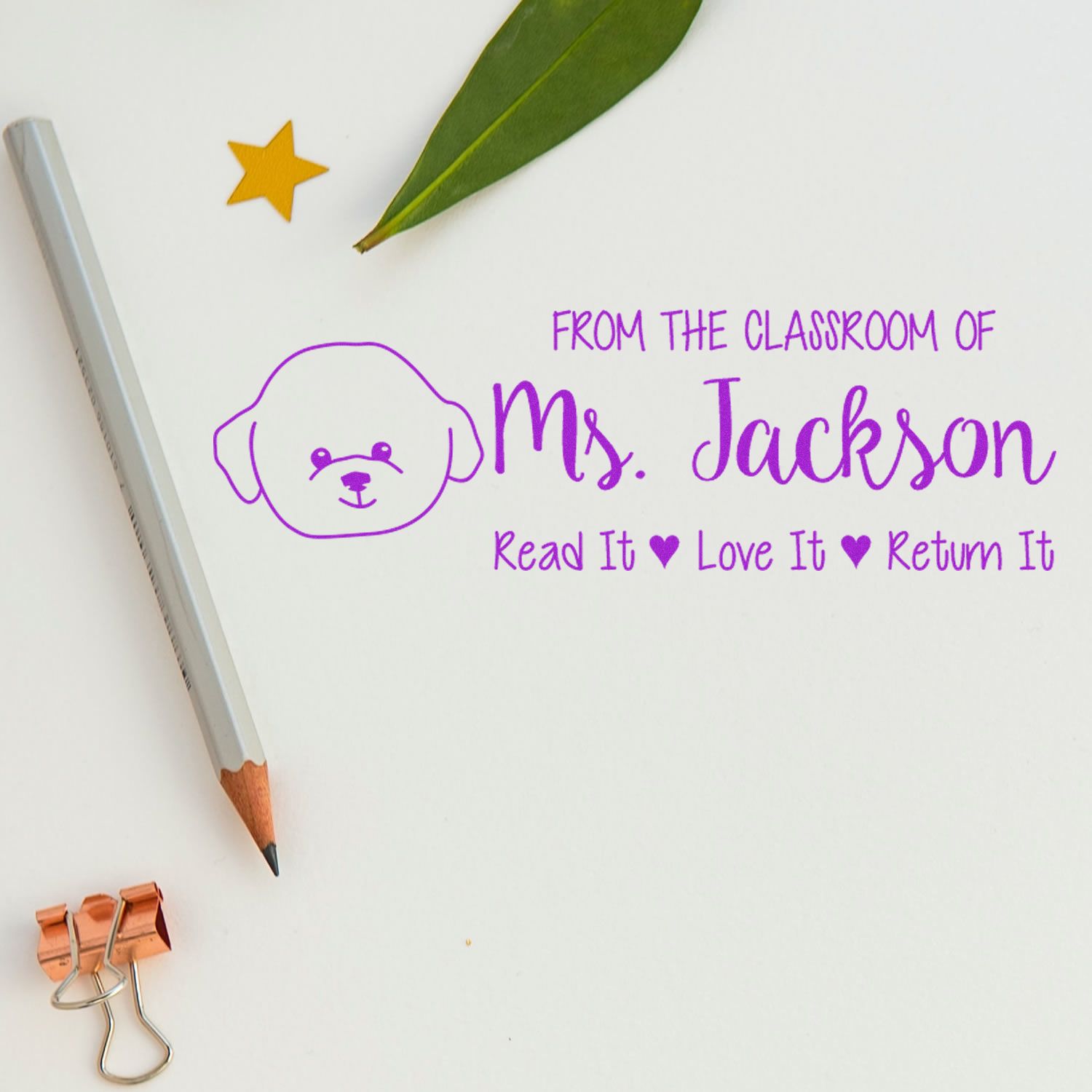 Personalized teacher rubber stamp reading From the Classroom of Ms. Jackson, Read It, Love It, Return It with dog icon.