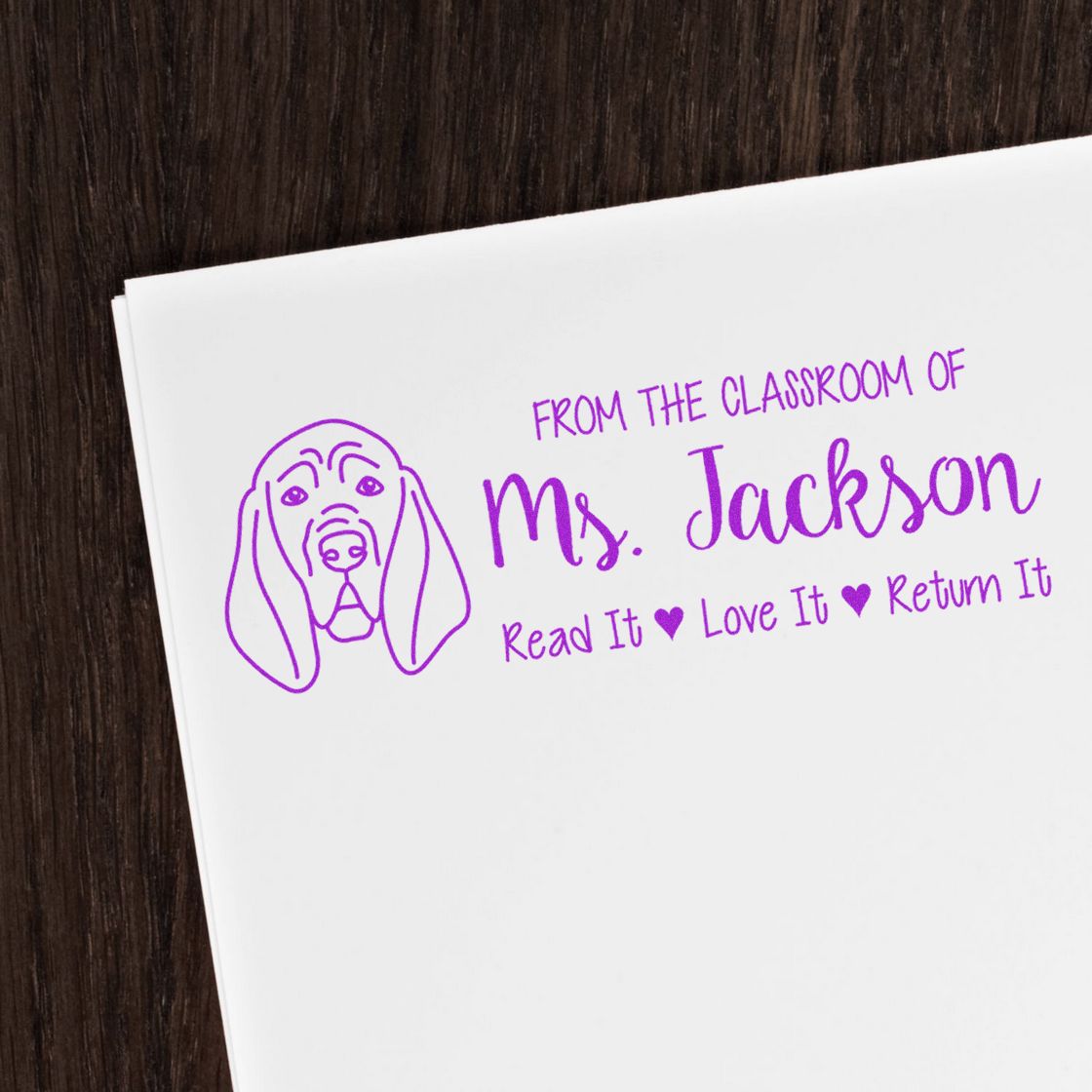 Custom teacher rubber stamp for Ms. Jackson with dog design and Read It, Love It, Return It classroom book label.