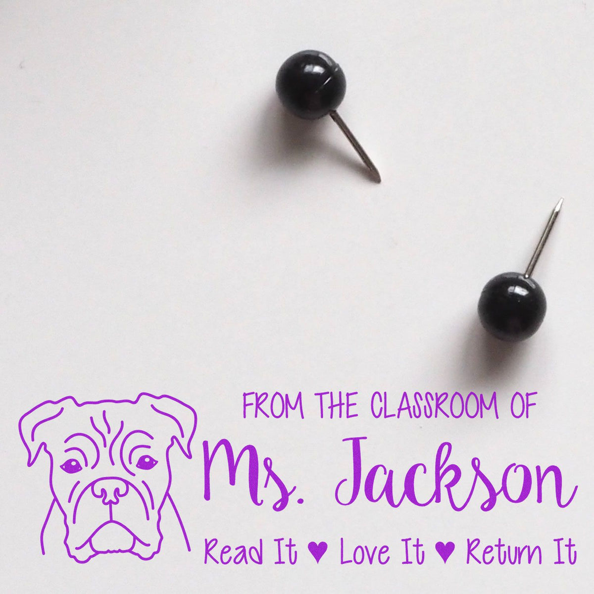 Custom classroom book stamp for Ms. Jackson with bulldog, Read It Love It Return It, and push pins on white background.