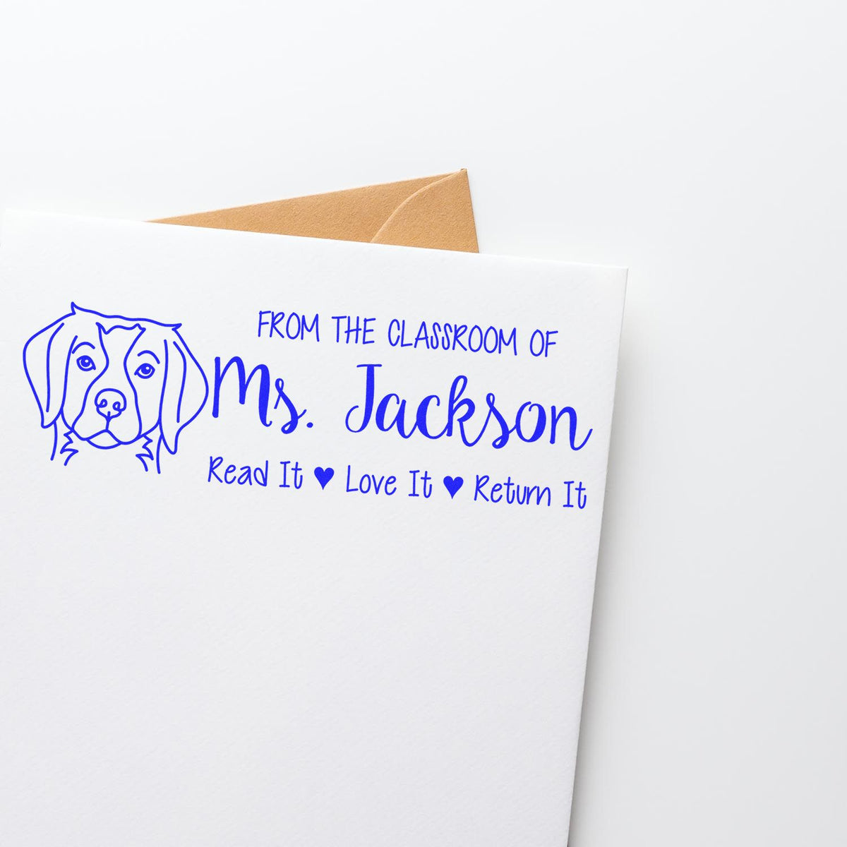 Custom classroom rubber stamp for Ms. Jackson with dog graphic and Read It Love It Return It book label for library materials.