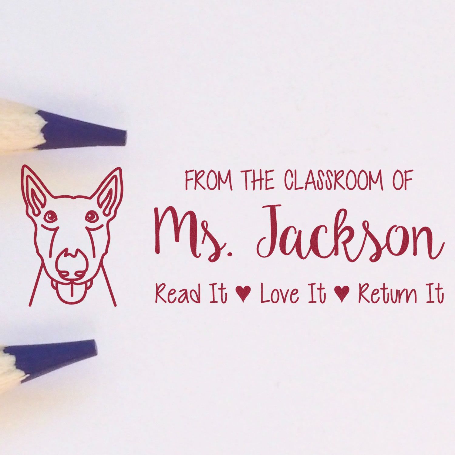 Personalized teacher rubber stamp with dog graphic and Read It, Love It, Return It message for Ms. Jacksons classroom library.
