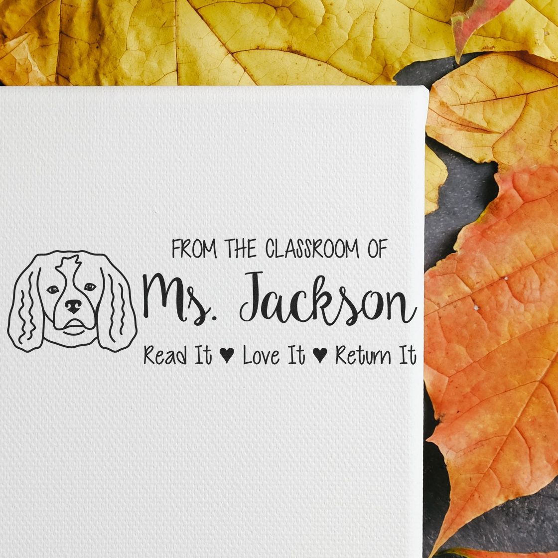 Custom classroom rubber stamp for Ms. Jacksons books with dog icon and Read It, Love It, Return It message.