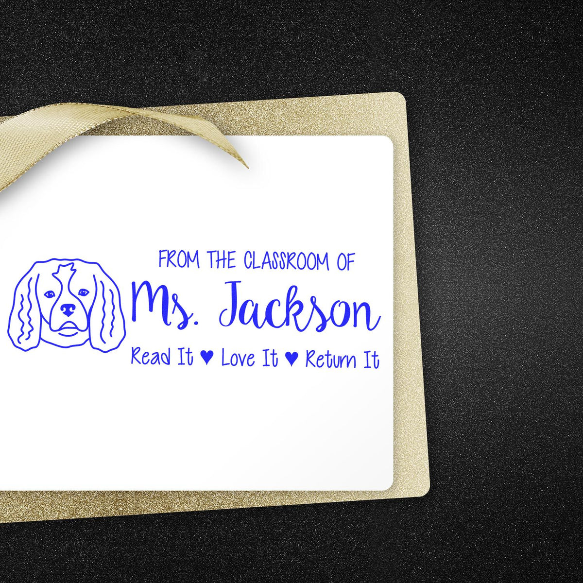Custom teacher library rubber stamp for Ms. Jackson, with dog icon and Read It, Love It, Return It message.