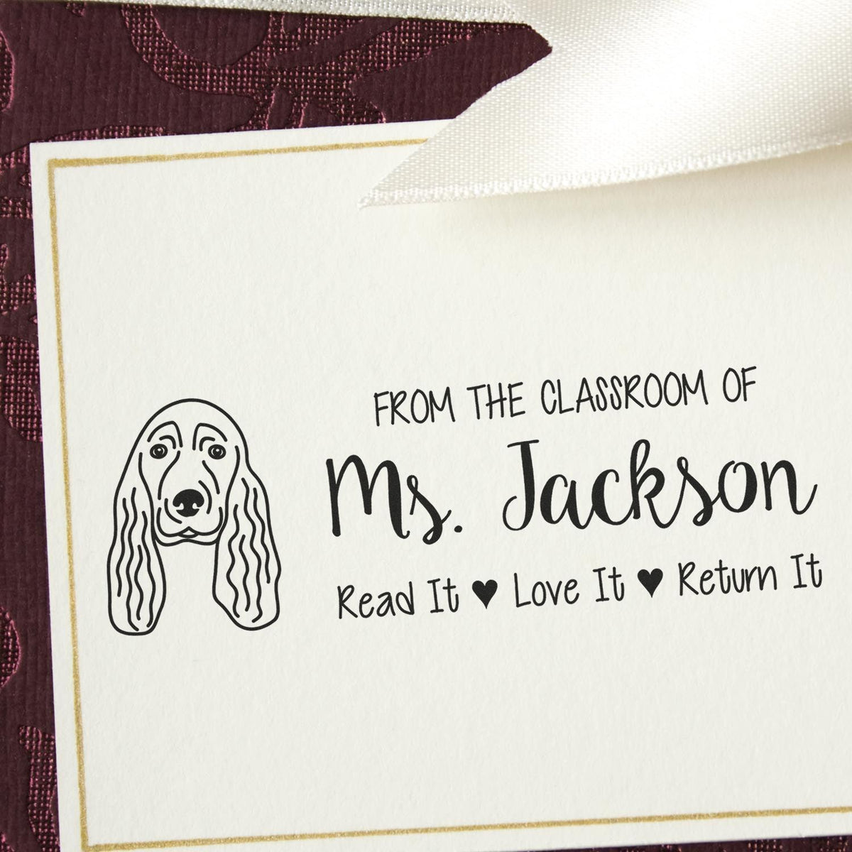Personalized classroom book stamp for Ms. Jackson with dog illustration and Read It, Love It, Return It message