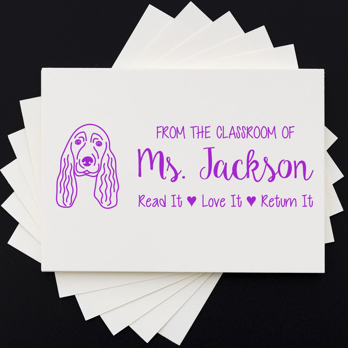 Personalized classroom rubber stamp for Ms. Jackson with dog design and Read It, Love It, Return It book label.