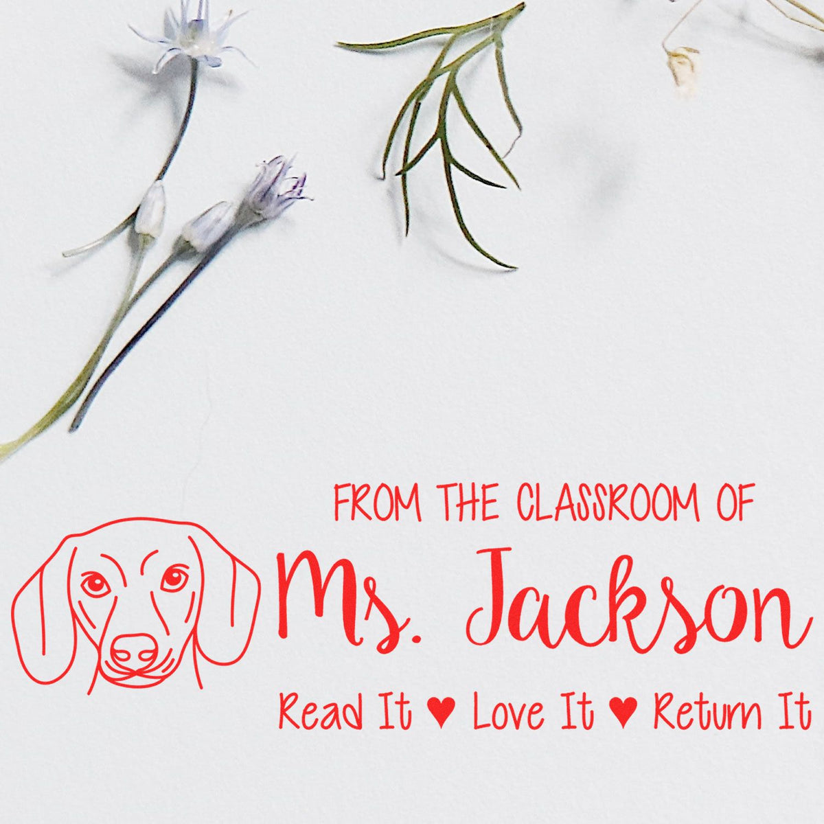 Personalized classroom book stamp with dog logo and return message for Ms. Jacksons library, Read It Love It Return It.