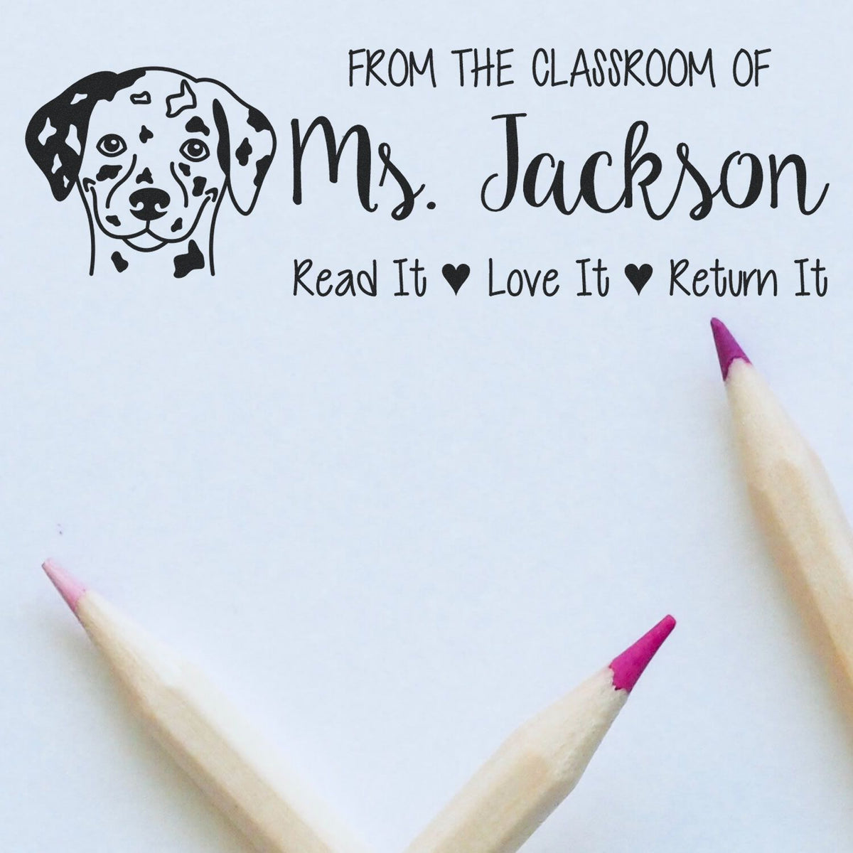 Personalized teacher rubber stamp with dalmatian dog and Read It Love It Return It classroom book label for Ms. Jackson.
