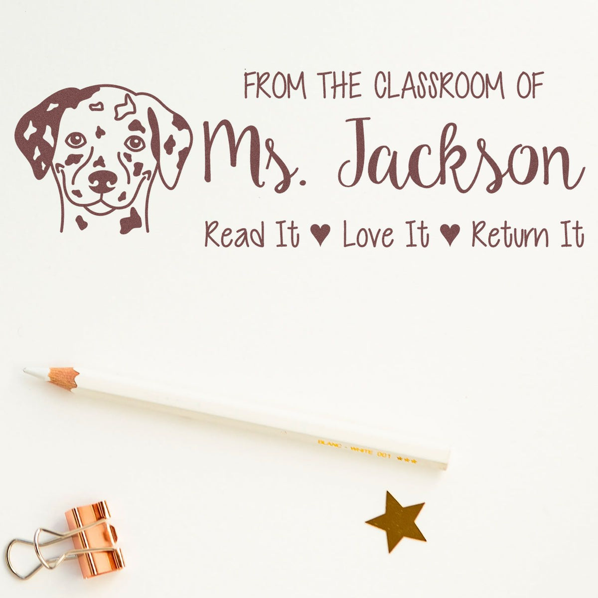 Personalized teacher book stamp with Dalmatian design and Read It, Love It, Return It library message for Ms. Jackson.