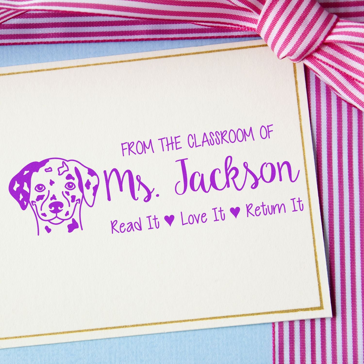 Personalized teacher rubber stamp for classroom books: Ms. Jackson, Read It, Love It, Return It with dog icon.