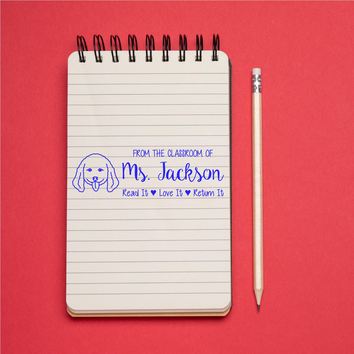 Personalized classroom book stamp for Ms. Jackson, featuring a dog icon and Read It, Love It, Return It reminder.