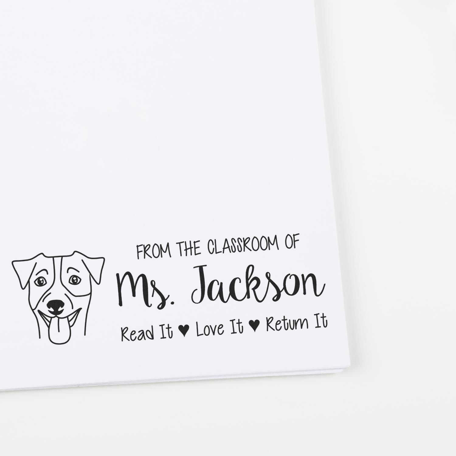Custom teacher rubber stamp for Ms. Jacksons classroom with dog icon and Read it, Love it, Return It book label.