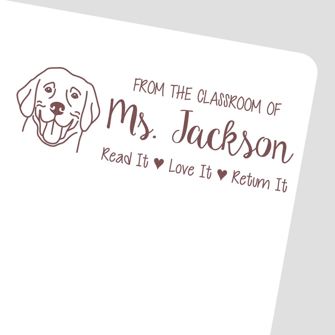 Personalized teacher rubber stamp with dog illustration and From the Classroom of Ms. Jackson, Read It Love It Return It text.