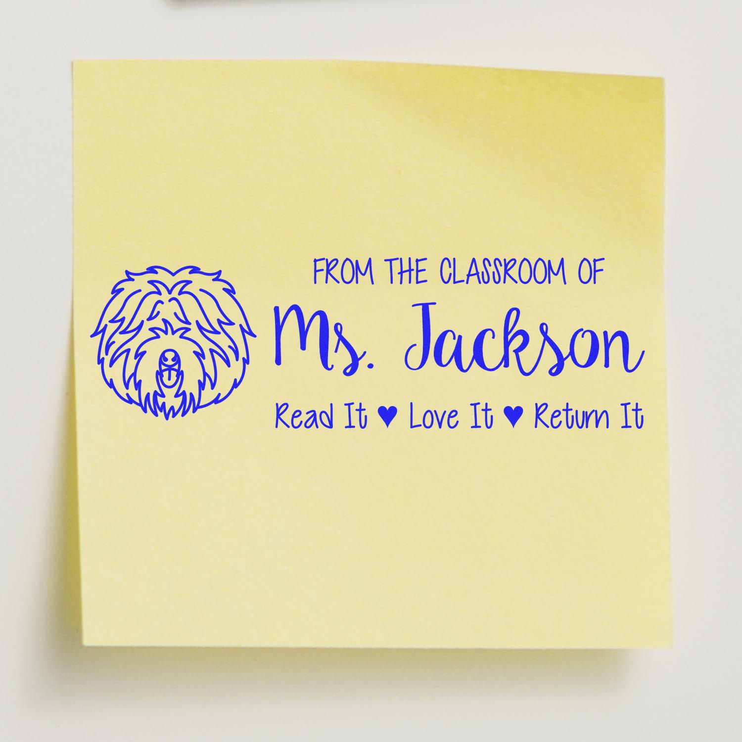 Custom teacher rubber stamp for Ms. Jackson, featuring a dog icon and Read It, Love It, Return It classroom book label.