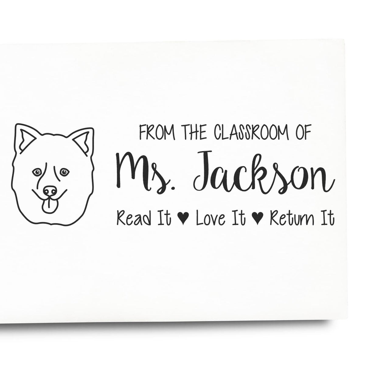 Custom classroom rubber stamp for Ms. Jackson with dog icon and book return reminder: Read It, Love It, Return It.