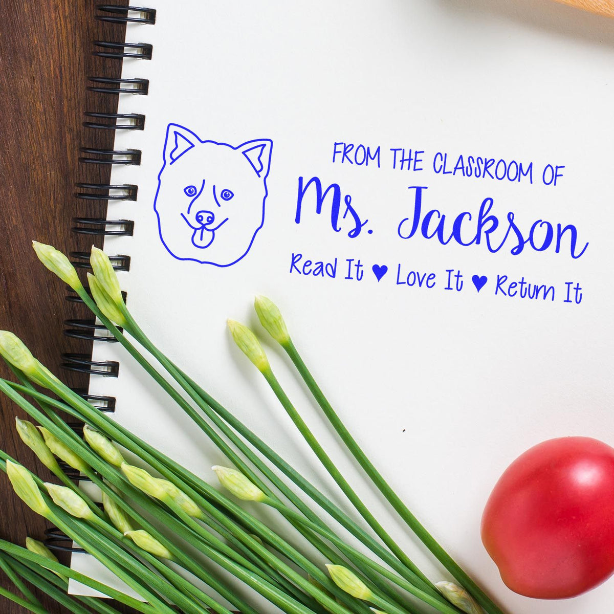 Custom teacher rubber stamp for Mrs. Jackson with dog icon and Read It, Love It, Return It classroom book label.