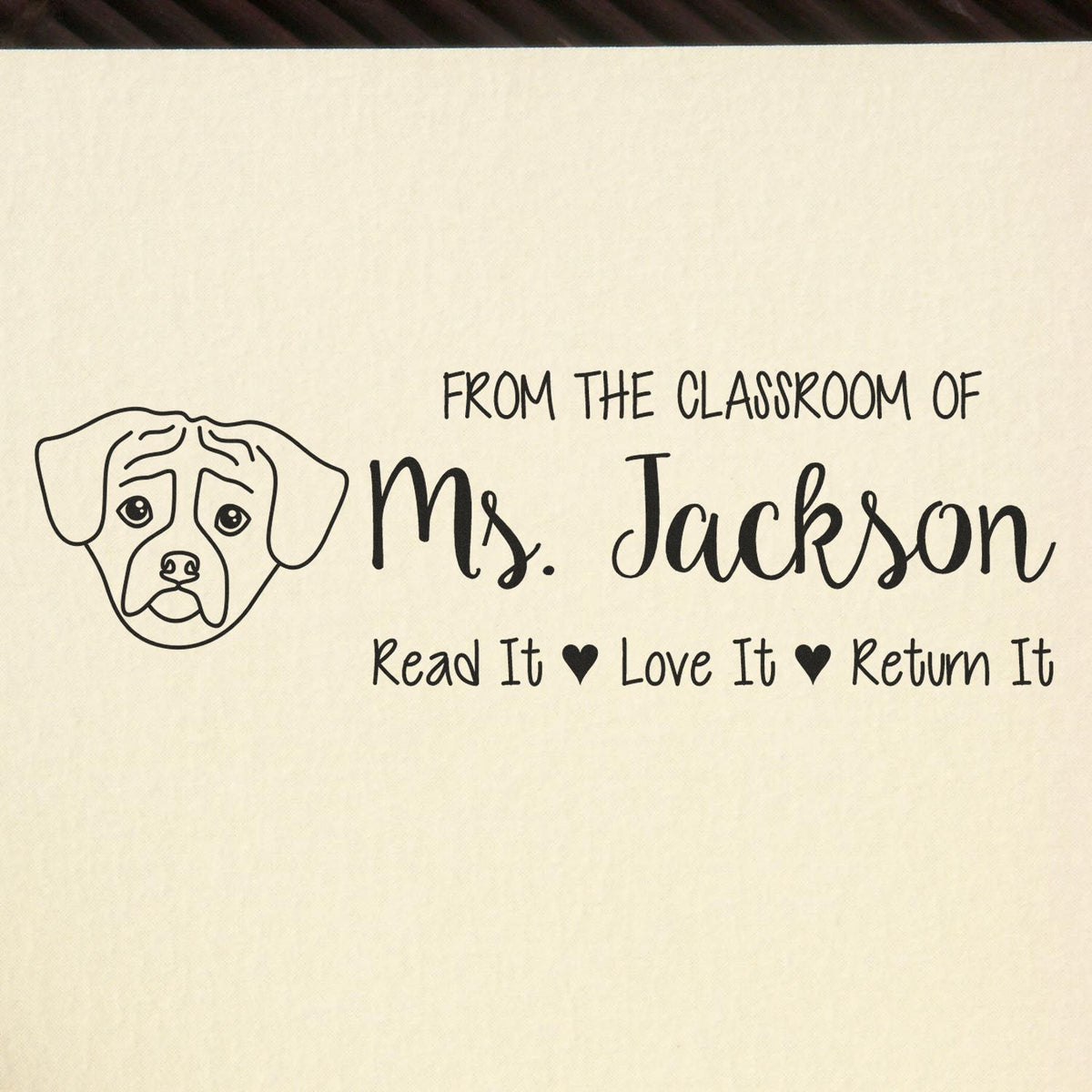 Personalized teacher book stamp with dog illustration: From the Classroom of Ms. Jackson, Read It Love It Return It.