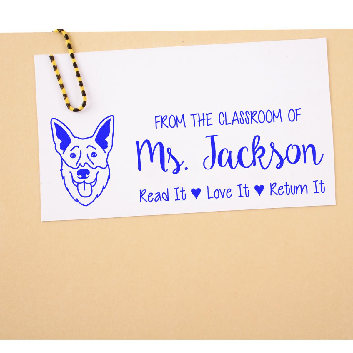 Personalized teacher rubber stamp for Ms. Jackson with dog icon and Read It, Love It, Return It book return message.