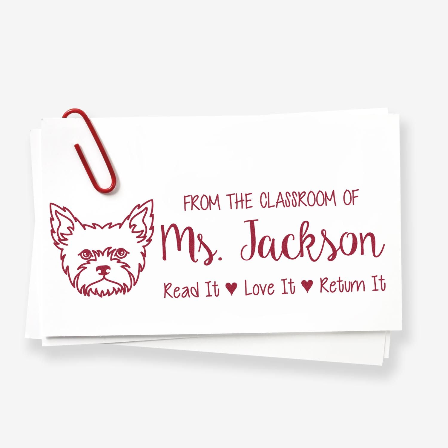 Custom classroom book return rubber stamp for Ms. Jackson, featuring a dog icon and "Read It Love It Return It" message.